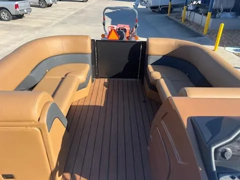 Slide: The Image of 2025 Bentley Pontoons 223 Elite Swingback Dual Captain interior with tan and gray seating. - 3