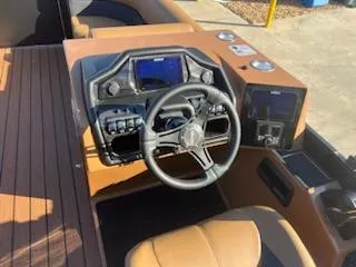 Slide: The Image of 2025 Bentley Pontoons 223 Elite dashboard with dual captain seats and modern controls. - 7