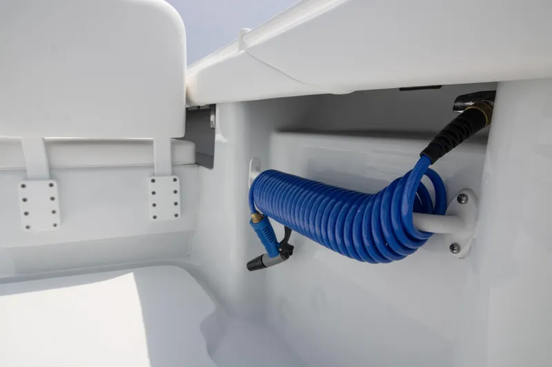 Slide: The Image of 2025 Yellowfin 26 Hybrid boat interior with coiled blue hose. - 20