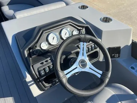 Slide: The Image of 2025 Bentley Pontoons 200 CRUISE dashboard with steering wheel and gauges. - 5