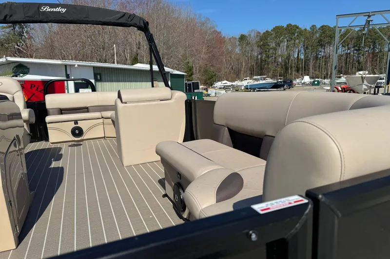 Slide: The Image of 2026 Bentley Pontoons 200 CRUISE interior with beige seating and open deck. - 10