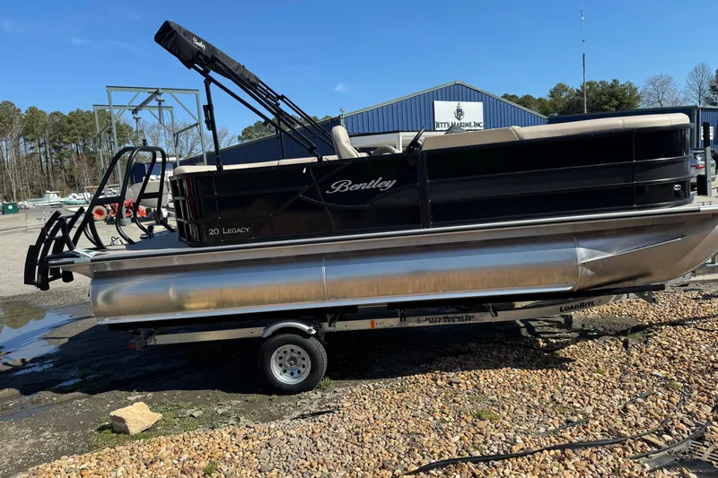Slide: The Image of 2026 Bentley Pontoons 200 CRUISE on trailer, parked outdoors near marine facility. - 12
