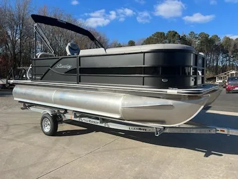 Slide: The Image of 2025 Bentley Pontoons 200 CRUISE on trailer, parked outdoors under blue sky. - 2