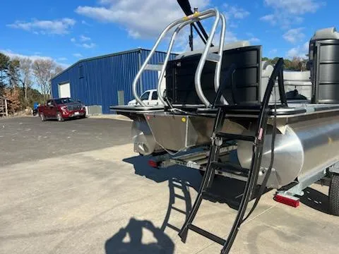 Slide: The Image of 2025 Bentley Pontoons 200 CRUISE on trailer, parked near blue building. - 3