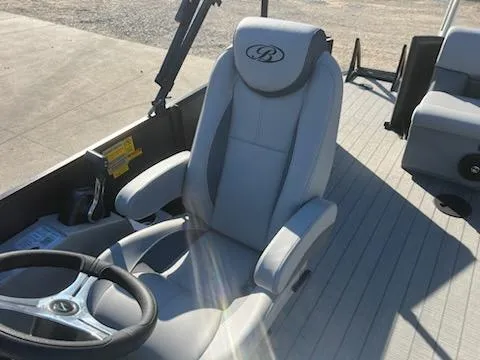 Slide: The Image of 2025 Bentley Pontoons 200 CRUISE captain's chair and steering wheel on deck. - 7