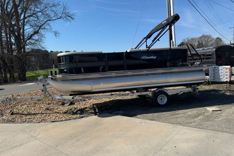 Slide: The Image of 2026 Bentley Pontoons 200 CRUISE on trailer, parked outdoors under clear blue sky. - 8