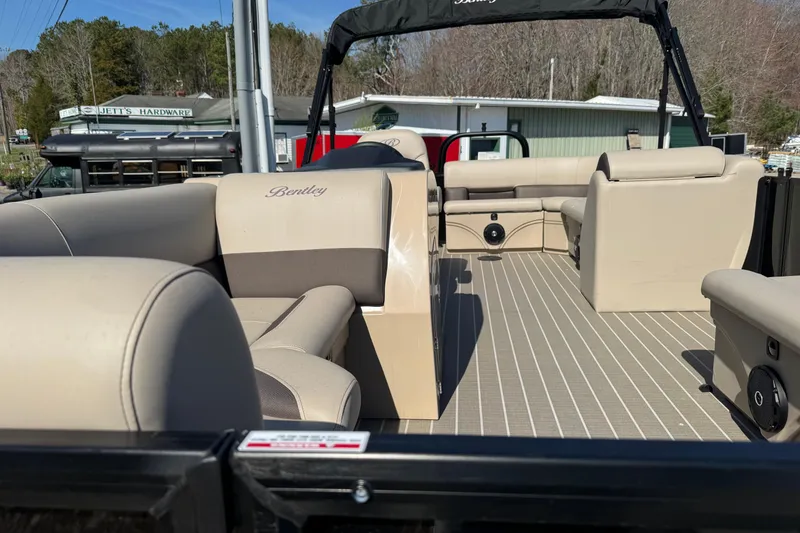 Slide: The Image of 2026 Bentley Pontoons 200 CRUISE interior with beige seating and spacious deck. - 9