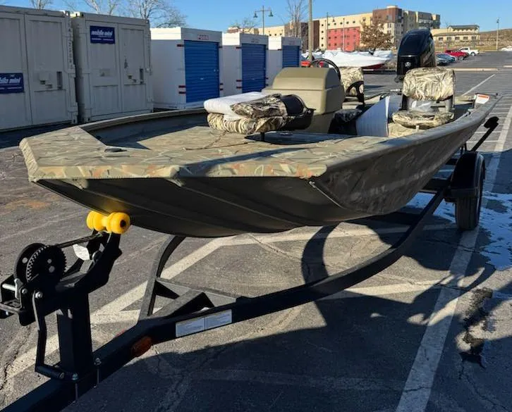 Slide: The Image of 2025 Tracker Grizzly 1754 SC boat on trailer in parking lot. - 2