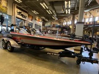 The Image of 2025 Nitro Z20 XL Pro boat displayed in a showroom with modern interior lighting. - 0