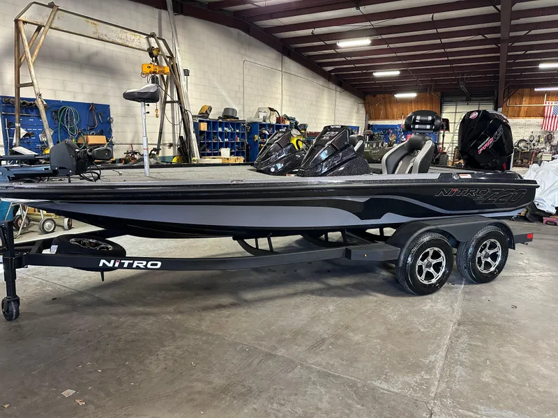 The Image of 2025 Nitro Z20 XL Pro boat in a warehouse, showcasing sleek design and modern features. - 0
