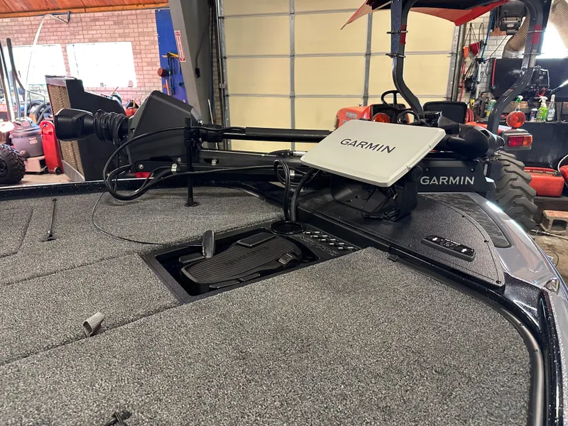 Slide: The Image of 2025 Nitro Z20 XL Pro boat with Garmin navigation system in a garage setting. - 11