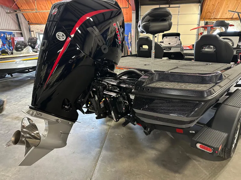 Slide: The Image of 2025 Nitro Z20 XL Pro boat with powerful outboard motor in a garage setting. - 5