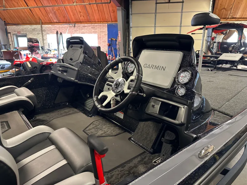 Slide: The Image of 2025 Nitro Z20 XL Pro boat interior with Garmin display and dual seating. - 9