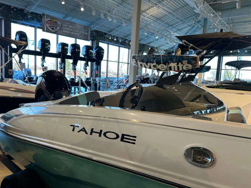 Slide: The Image of 2025 Tahoe T18 boat displayed in a showroom with modern interior and lighting. - 4
