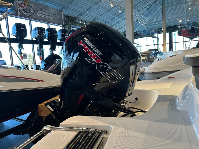Slide: The Image of 2025 Tahoe T18 boat with Mercury Pro XS engine in showroom. - 5