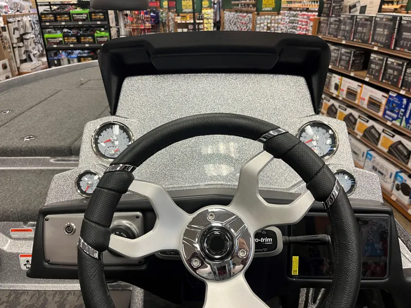 Slide: The Image of 2025 Nitro Z21 XL boat dashboard with steering wheel and gauges. - 10