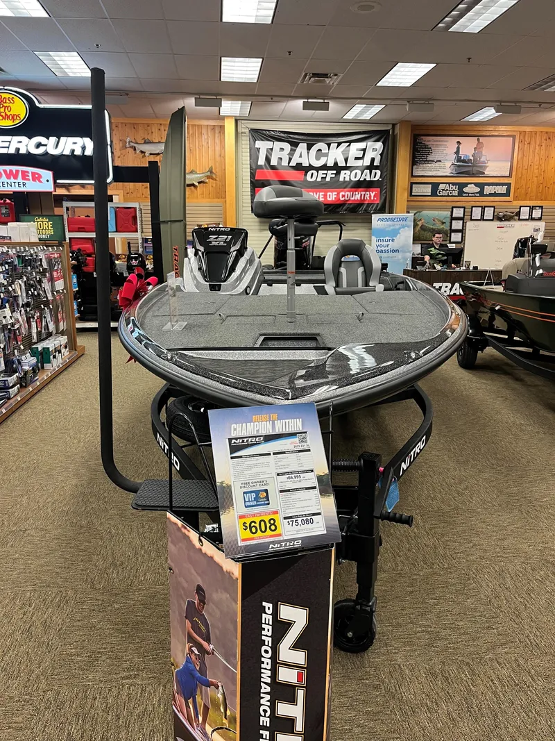 Slide: The Image of 2025 Nitro Z21 XL boat displayed in showroom with promotional signage. - 4