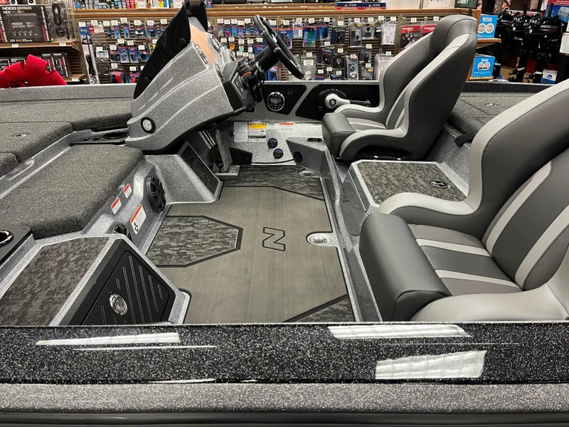 Slide: The Image of 2025 Nitro Z21 XL boat interior with sleek gray seating and modern dashboard. - 8