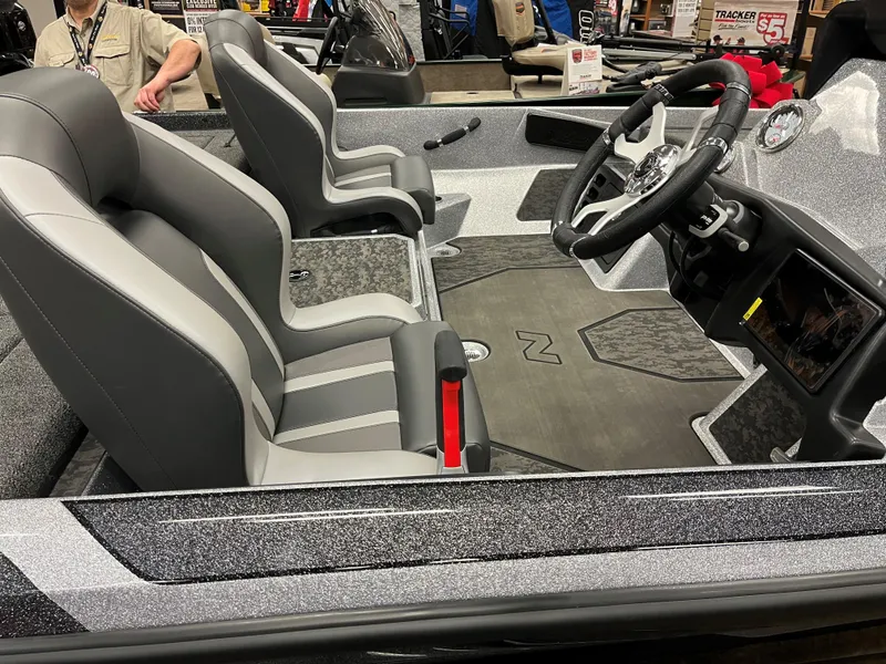 Slide: The Image of 2025 Nitro Z21 XL boat interior with sleek gray seating and modern dashboard. - 9