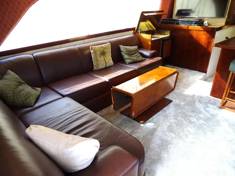 Slide: The Image of Luxurious 1987 Ocean Yachts 48 interior with leather seating and elegant wood accents. - 11