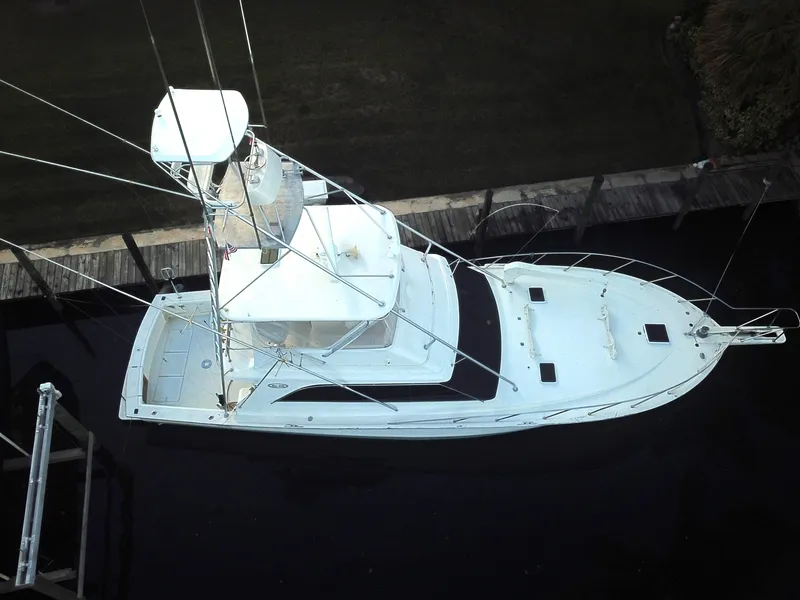 Slide: The Image of Aerial view of 1987 Ocean Yachts 48 docked, showcasing sleek design and spacious deck. - 2