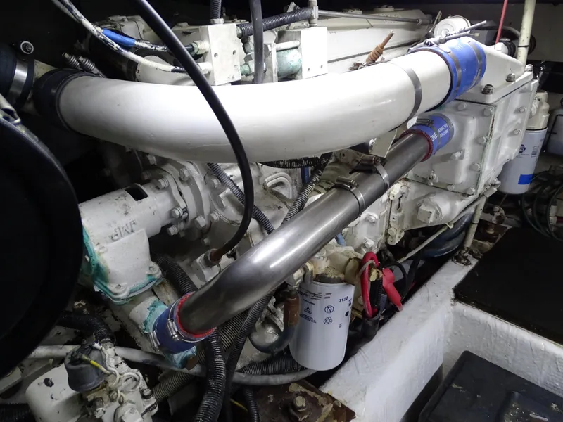 Slide: The Image of Engine room of 1987 Ocean Yachts 48, showcasing detailed mechanical components. - 26