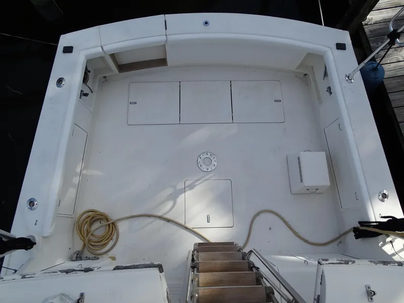 Slide: The Image of 1987 Ocean Yachts 48 cockpit view with storage compartments and coiled rope. - 29
