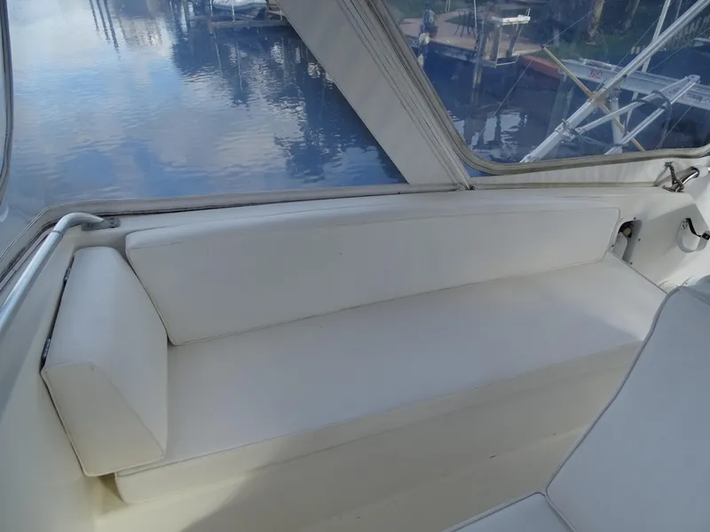 Slide: The Image of White seating area on a 1987 Ocean Yachts 48 boat, with water view. - 34