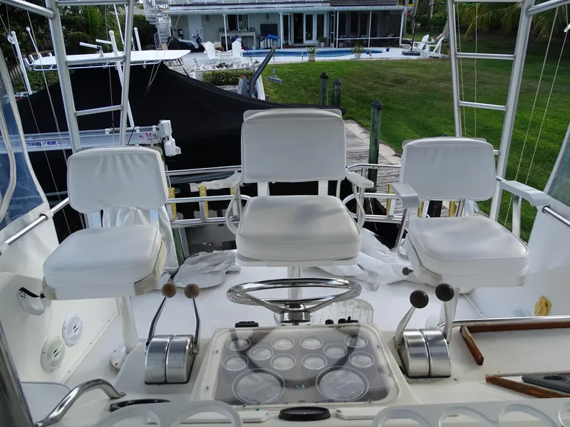 Slide: The Image of Ocean Yachts 48 cockpit with three white captain chairs, 1987 model. - 35