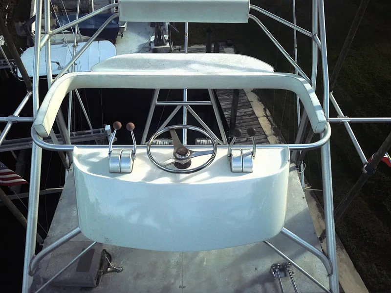 Slide: The Image of Helm of 1987 Ocean Yachts 48, featuring steering wheel and controls. - 5