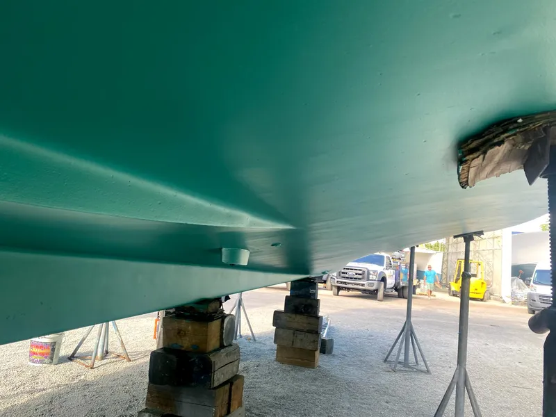 Slide: The Image of 1987 Ocean Yachts 48 hull on stands, undergoing maintenance in a boatyard. - 6