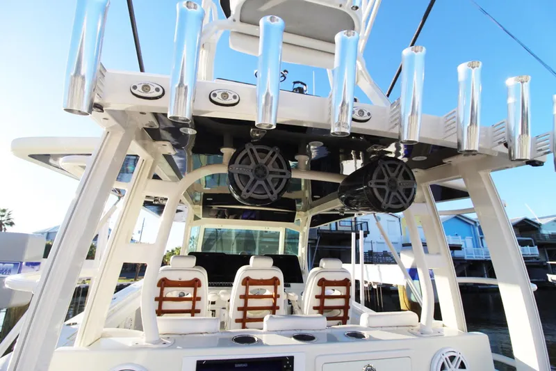 Slide: The Image of 2017 HCB Suenos boat interior with rod holders and seating. - 11