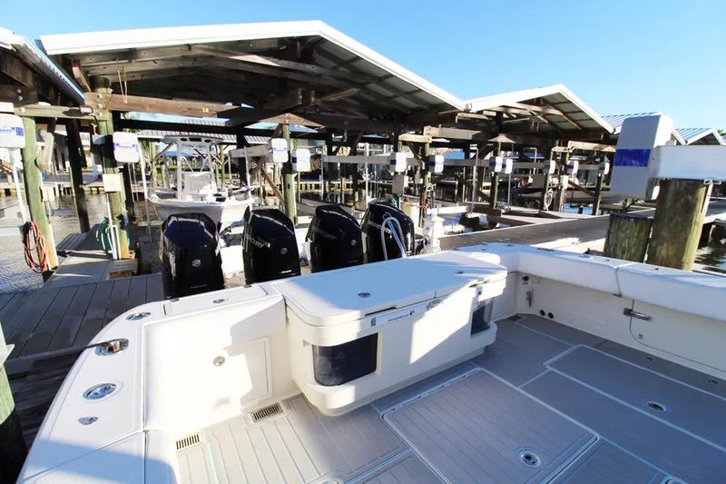 Slide: The Image of 2017 HCB Suenos boat docked with multiple outboard engines. - 12