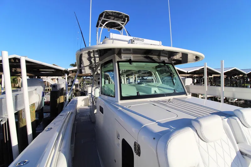 Slide: The Image of 2017 HCB Suenos boat docked under clear blue sky. - 19