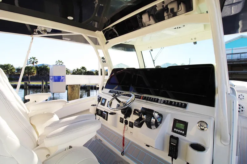 Slide: The Image of 2017 HCB Suenos boat cockpit with modern controls and luxurious seating. - 21