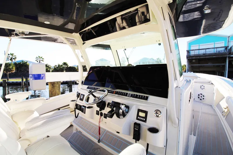 Slide: The Image of 2017 HCB Suenos boat interior with modern helm and controls. - 24