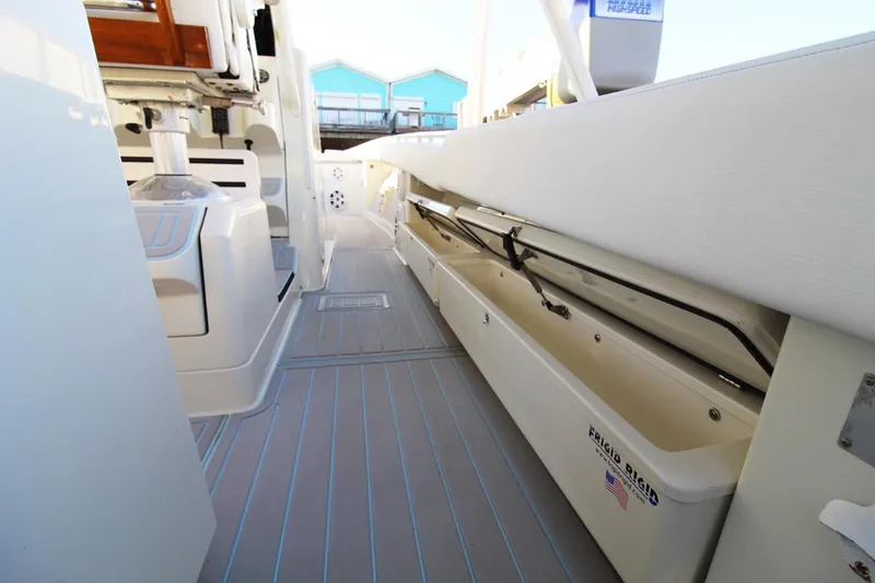 Slide: The Image of 2017 HCB Suenos boat interior with storage compartments and sleek design. - 26