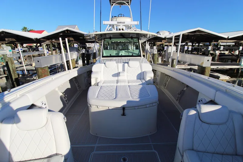 Slide: The Image of 2017 HCB Suenos boat with luxurious white seating and spacious deck. - 28