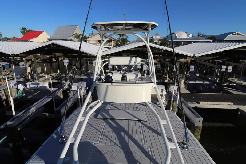 Slide: The Image of 2017 HCB Suenos boat docked at marina with clear blue sky. - 33