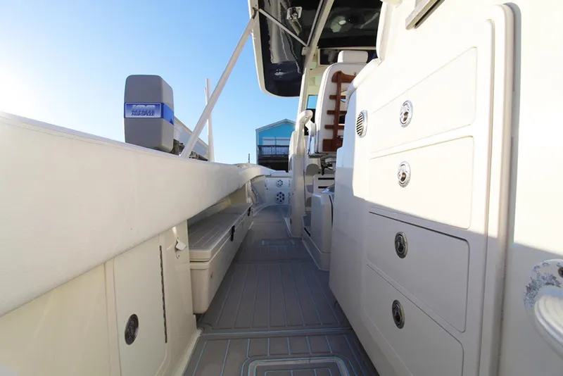 Slide: The Image of 2017 HCB Suenos boat interior with storage compartments and sleek design. - 6