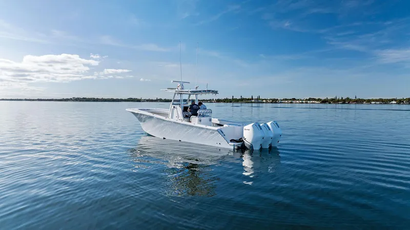 Slide: The Image of 2018 Onslow Bay 33 Tournament boat on calm water under blue sky. - 11