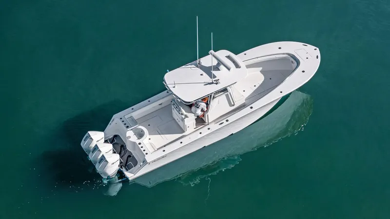 Slide: The Image of 2018 Onslow Bay 33 Tournament boat cruising on clear water. - 16
