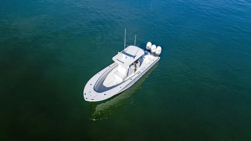 Slide: The Image of 2018 Onslow Bay 33 Tournament boat on calm blue water. - 17