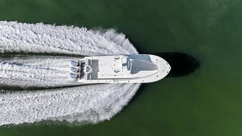 Slide: The Image of Aerial view of 2018 Onslow Bay 33 Tournament boat speeding on water. - 20