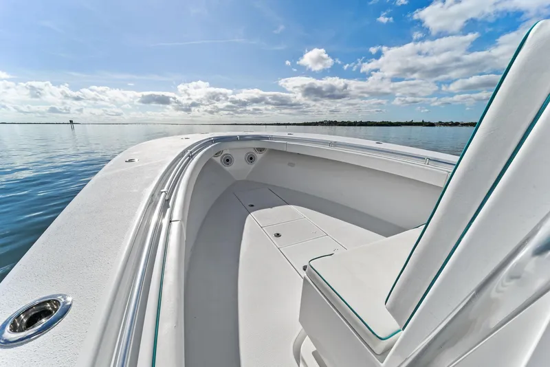 Slide: The Image of 2018 Onslow Bay 33 Tournament boat on calm water under a blue sky. - 23