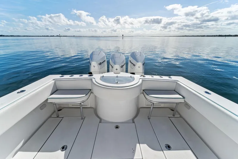 Slide: The Image of 2018 Onslow Bay 33 Tournament boat with triple engines on calm water. - 28