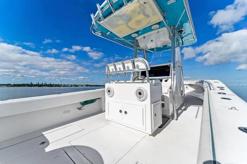 Slide: The Image of 2018 Onslow Bay 33 Tournament boat interior with blue sky and water backdrop. - 33