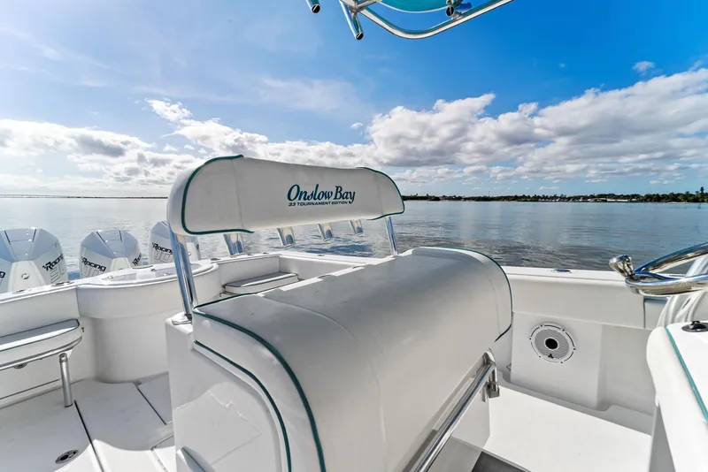 Slide: The Image of 2018 Onslow Bay 33 Tournament boat interior with seating, ocean view, and clear skies. - 35