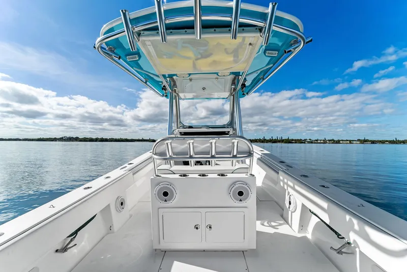 Slide: The Image of 2018 Onslow Bay 33 Tournament boat on calm water under blue sky. - 40