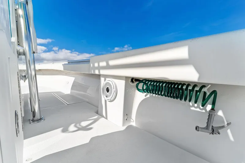 Slide: The Image of Onslow Bay 33 Tournament 2018 boat deck with coiled hose and clear blue sky. - 42